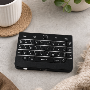 BBQ20KBD mini black keyboard in a cozy living room setting