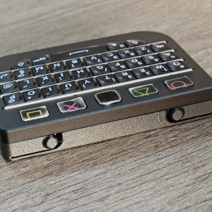 Black BBQ10KBD Pro keyboard showing two shoulder buttons and top control area