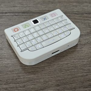 White BBQ10KBD Pro Q10 mini keyboard with center touchpad and top controls